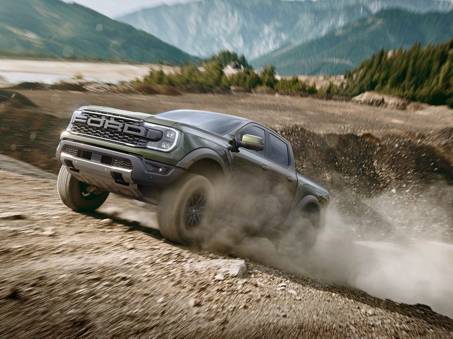 2026 Ranger® Raptor® being driven over rough terrain at high speeds in a mountainous desert