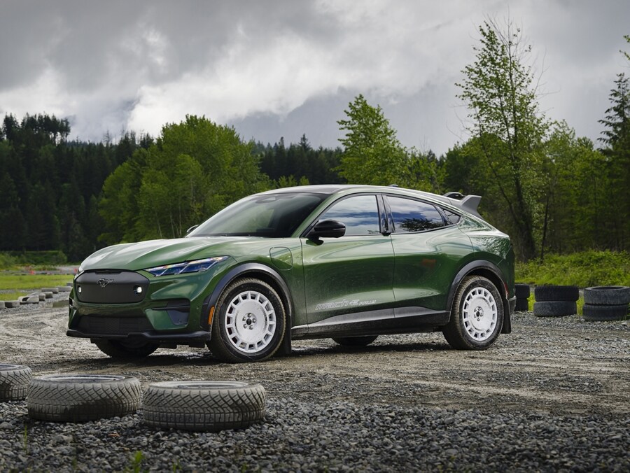 A green Ford Mustang Mach-E Rally® sitting on a dirt track
