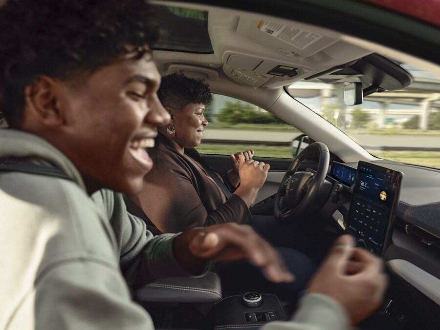 People in a Ford Mustang Mach-E using Ford BlueCruise hands-free driving