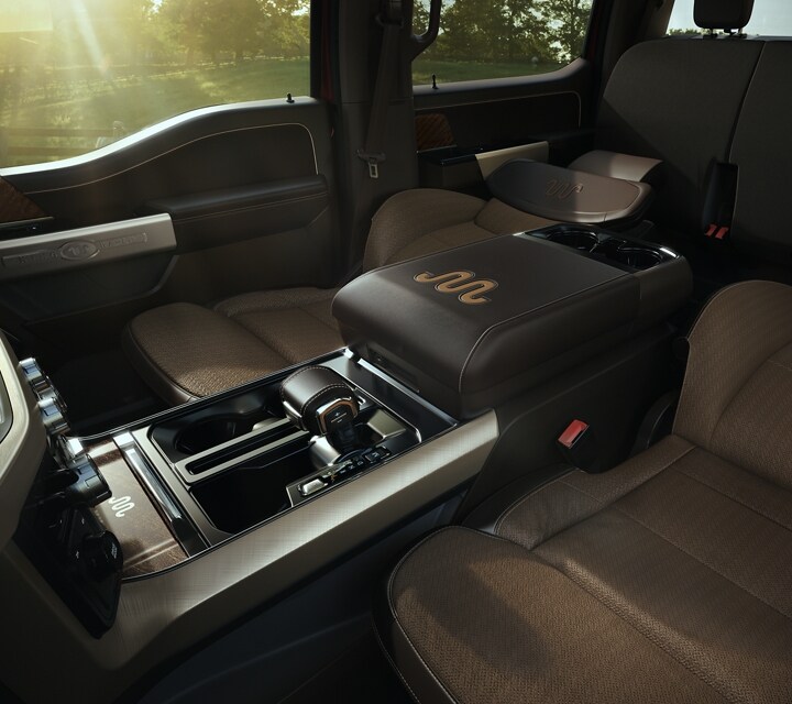 Interior image of the 2022 Ford F-150® King Ranch® with the front seats folded down