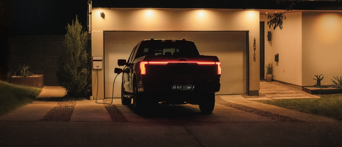 A 2023 Ford F-150 Lightning® is seen powering a home using Intelligent Backup Power