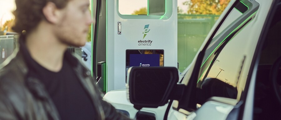 A Ford F-150® Lightning™ parked at an Electrify America charging station