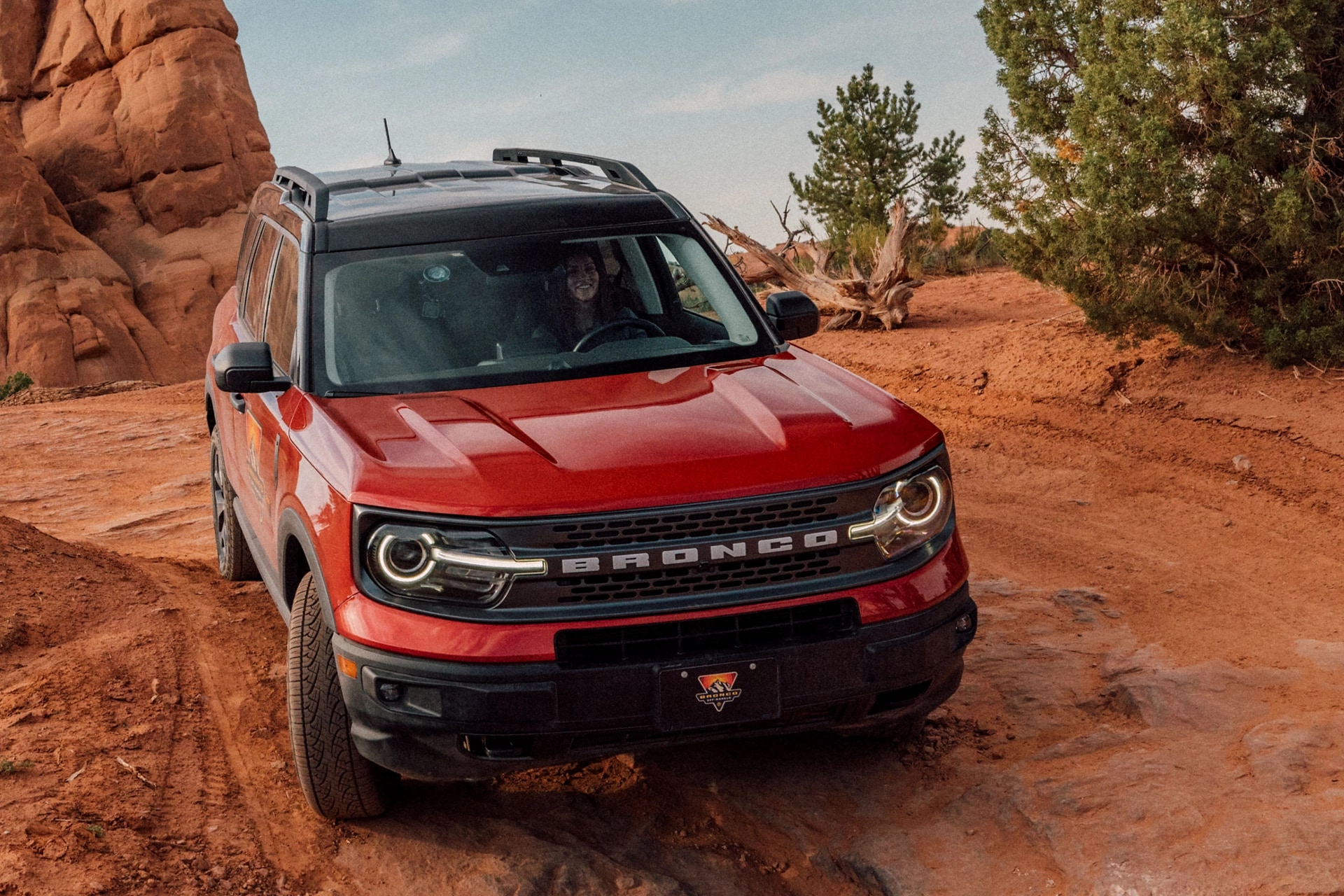 2024 Ford Bronco Sport® Badlands® in Hot Pepper Red being driven on a mountain road