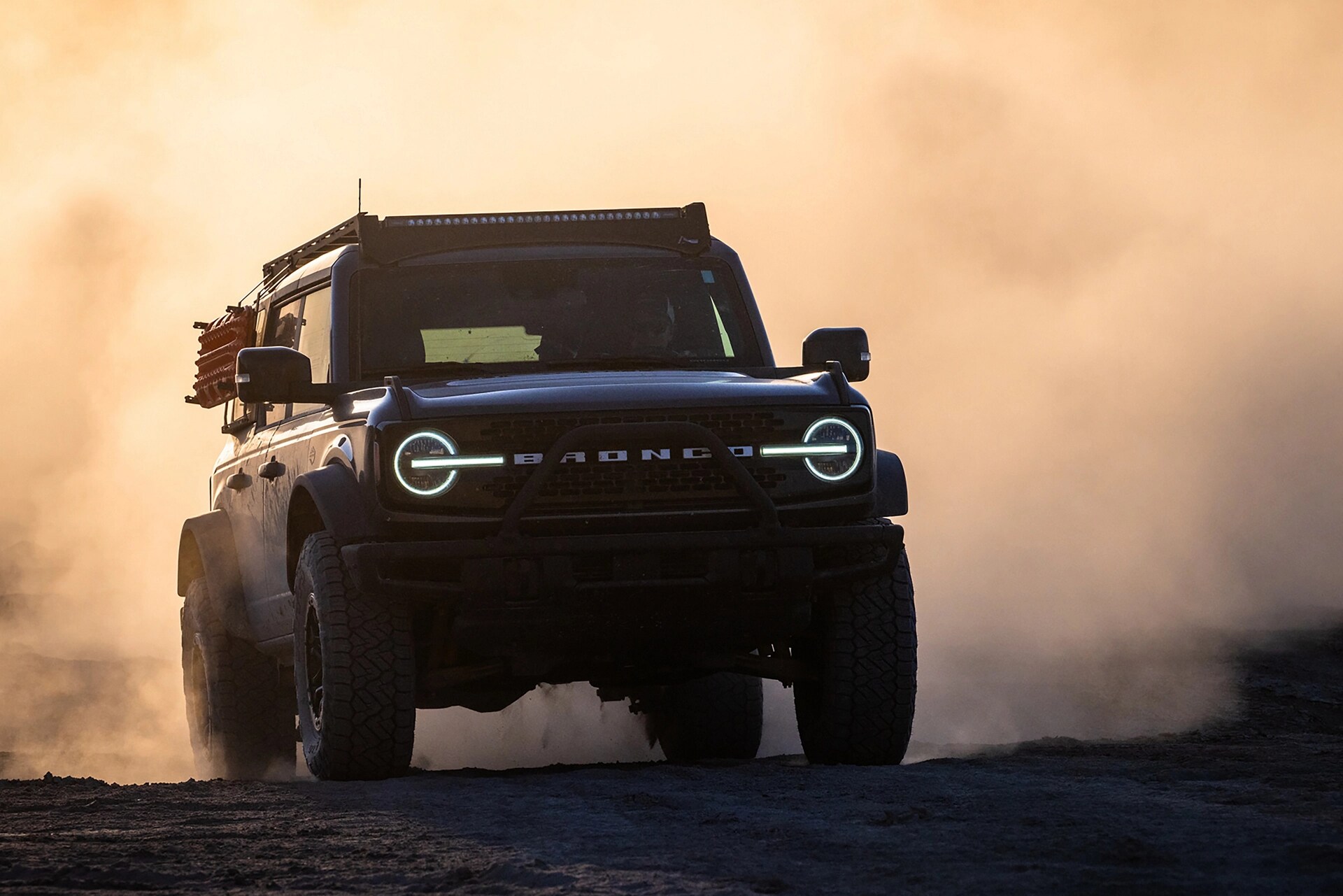 2024 Ford Bronco® Wildtrak® being driven in the desert at dusk
