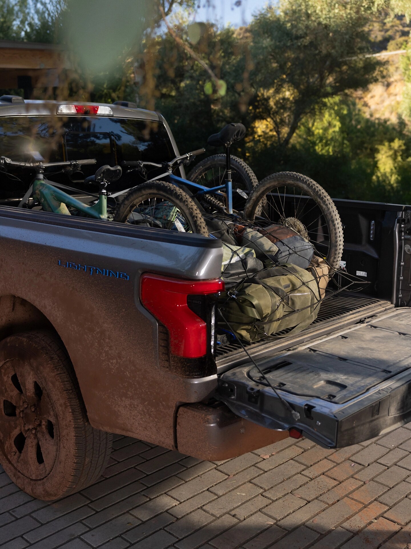 2025 Ford F-150 Lightning® truck bed filled with bikes and gear
