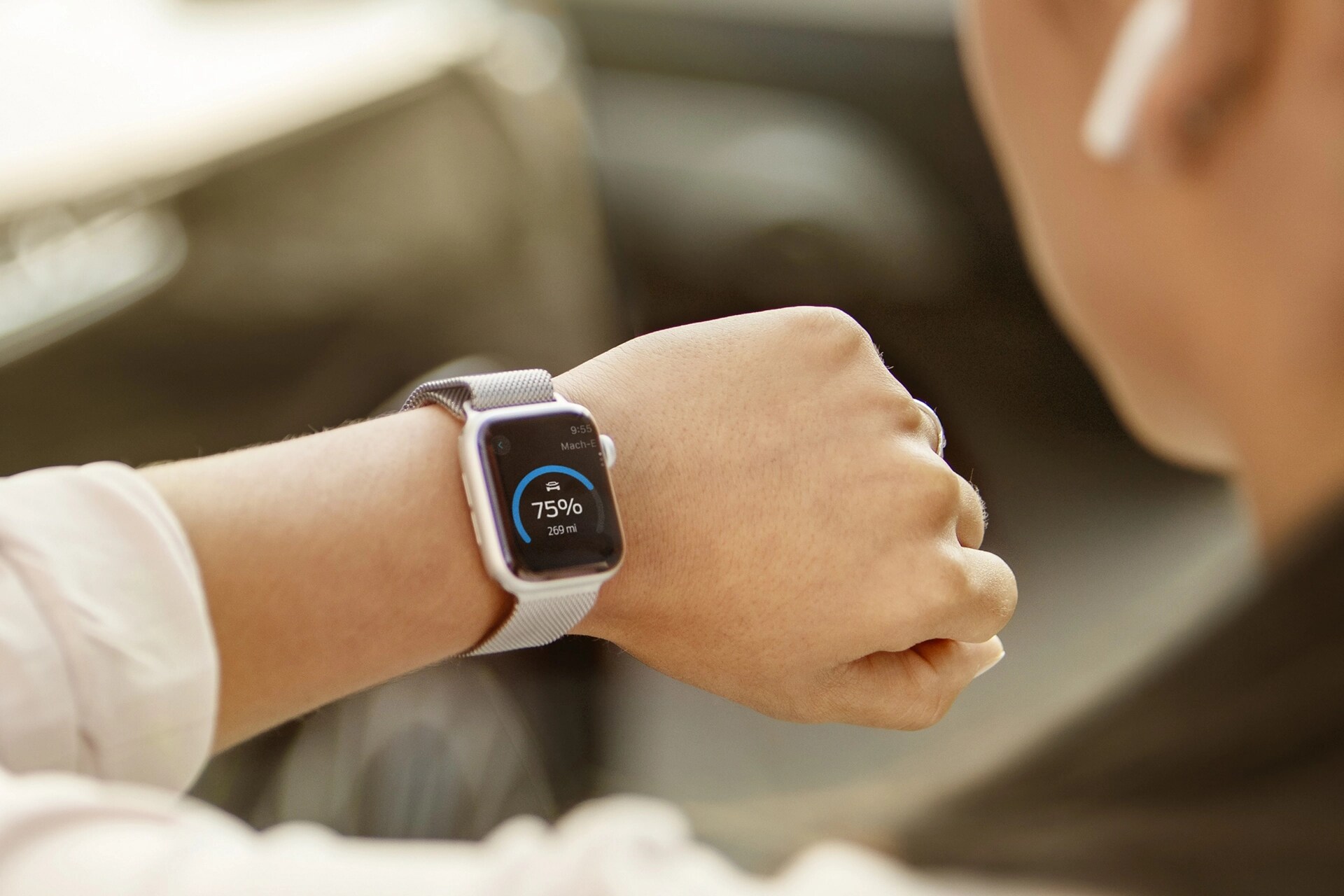 Close-up of a wrist with a smartwatch displaying 75%