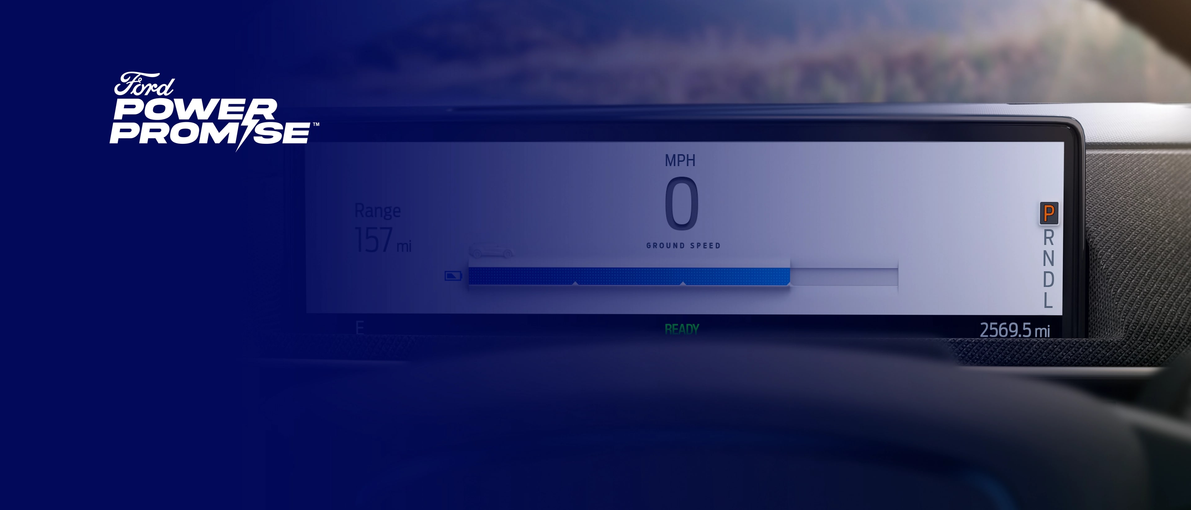 Ford Power Promise logo on a blue transparent overlay over image of range display