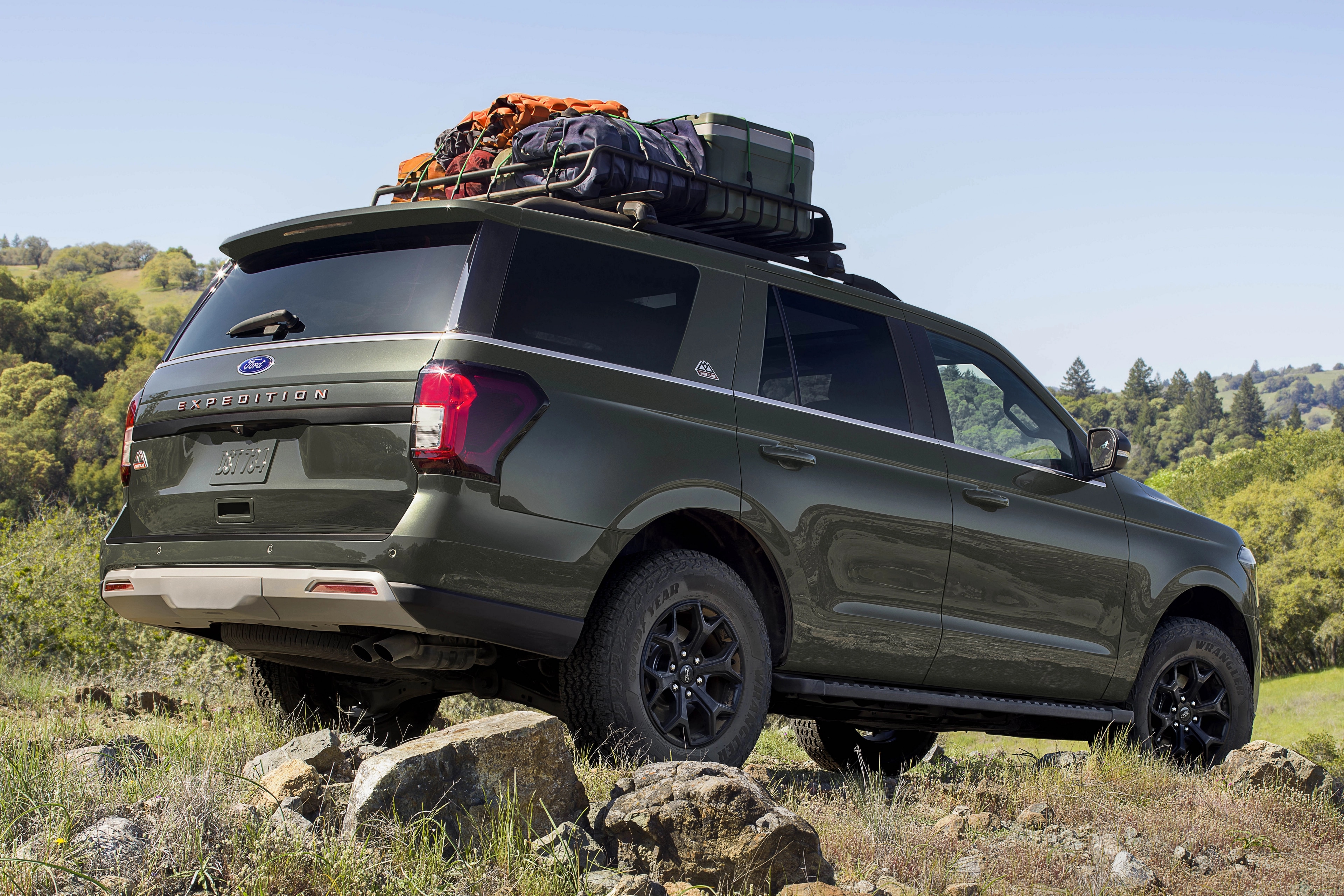 A 2024 Ford Expedition® parked on large rocks in a scenic location
