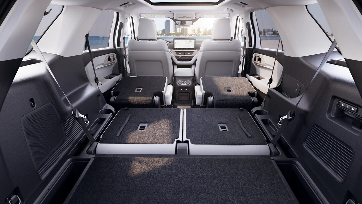 Cargo area of a 2025 Ford Explorer® SUV with second and third row seats folded down flat