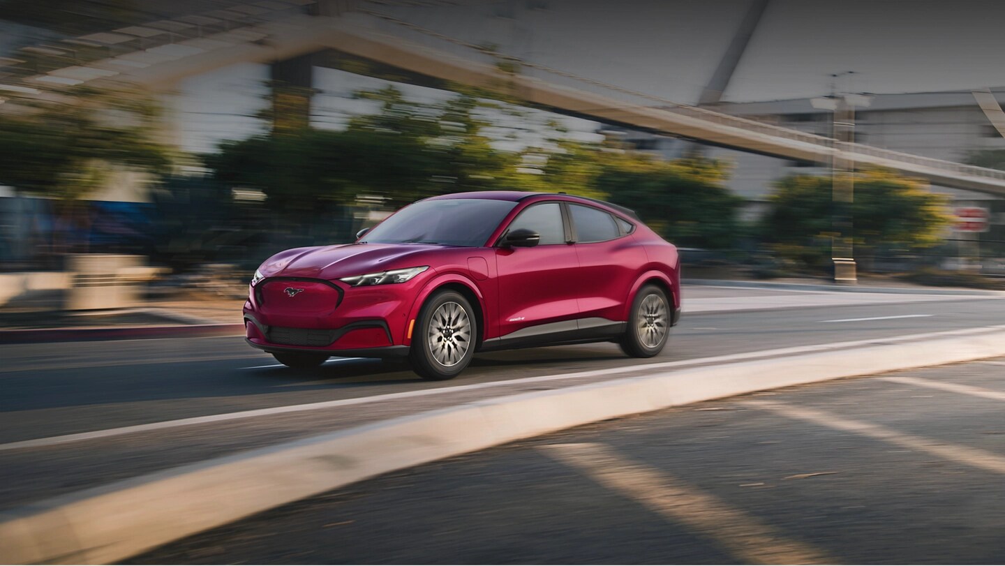 2025 Ford Mustang Mach-E® being driven down a city street