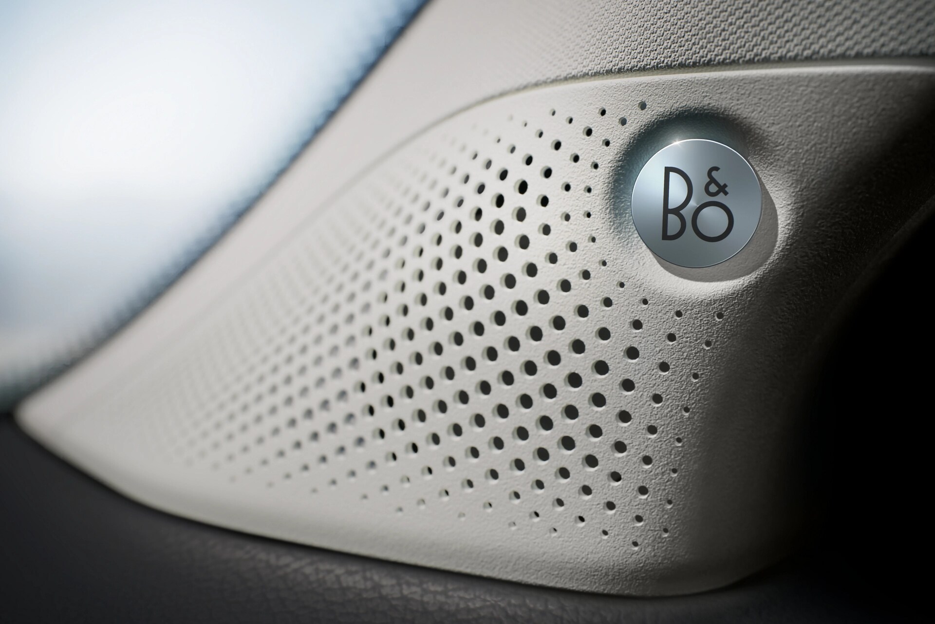 Close-up of the B&O speaker cover on the A-pillar