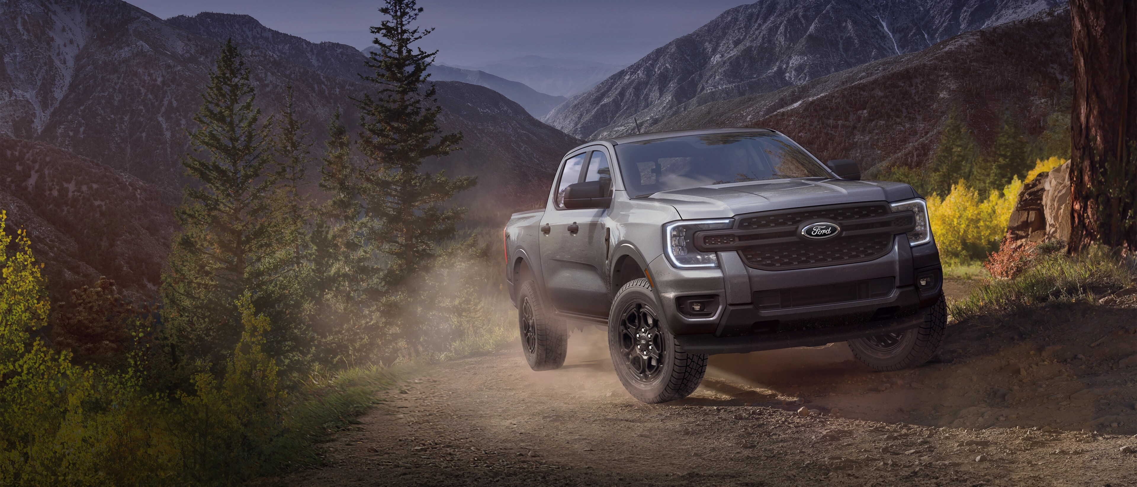 A 2025 Ford Ranger® truck being driven up a mountain trail