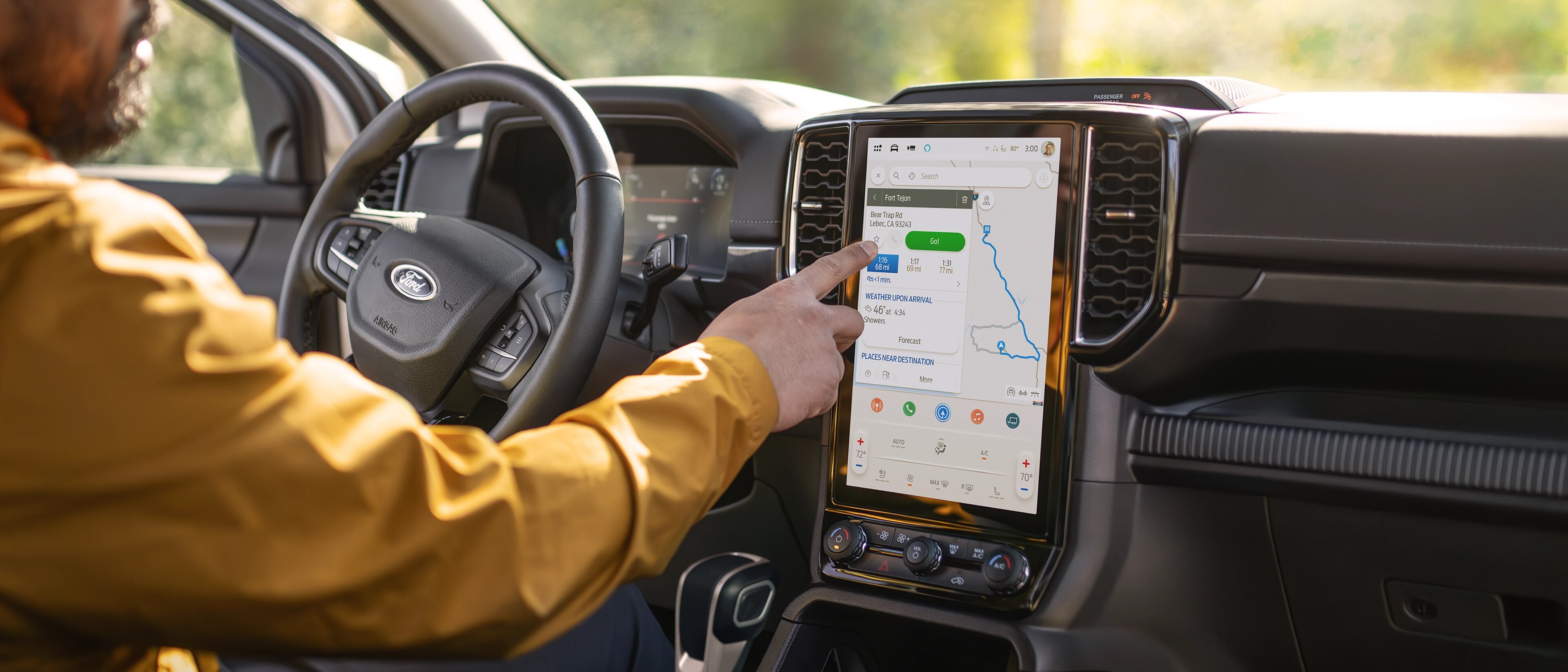 Person using 12-inch touchscreen in the 2025 Ford Ranger®