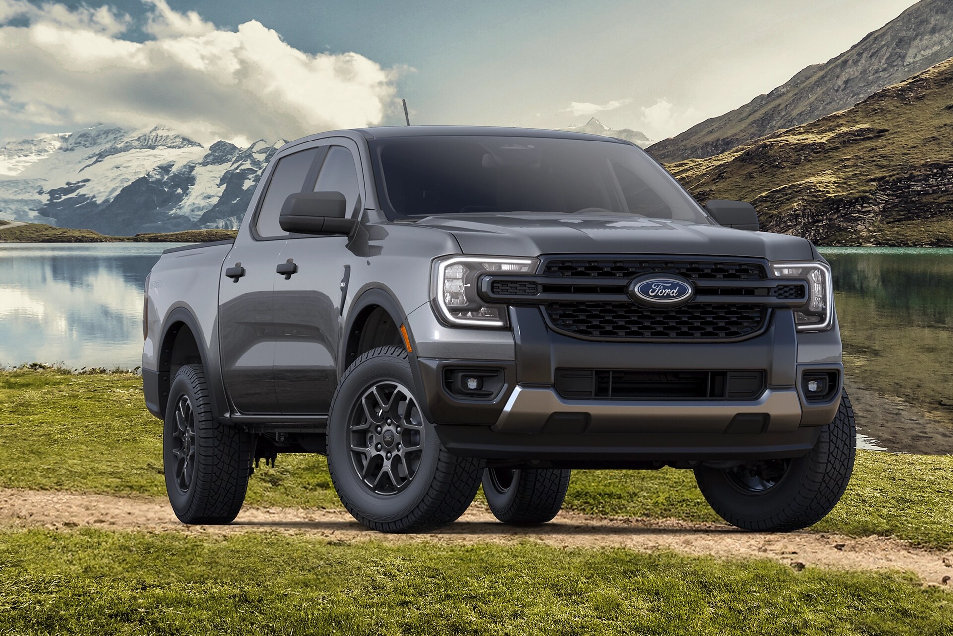 A Sport Appearance Package parked on gravel at the foot of the mountains