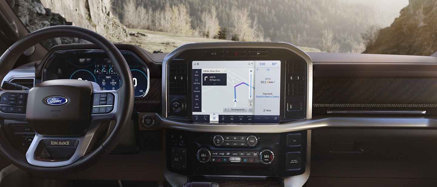 Available touchscreen displaying various available apps and features on the available SYNC® 4 system
