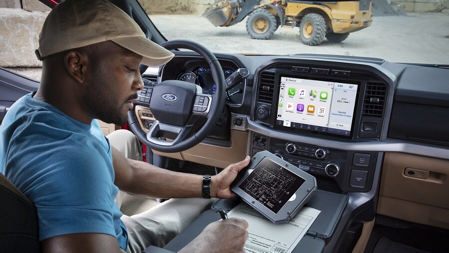 Person using available wireless connectivity on a mobile device at a jobsite