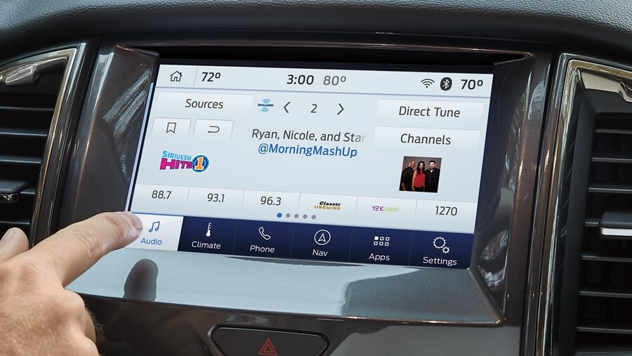 Person using available SiriusXM® on a touchscreen
