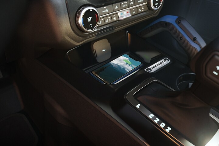 Interior of 2024 Ford Bronco® showing the available wireless charging pad