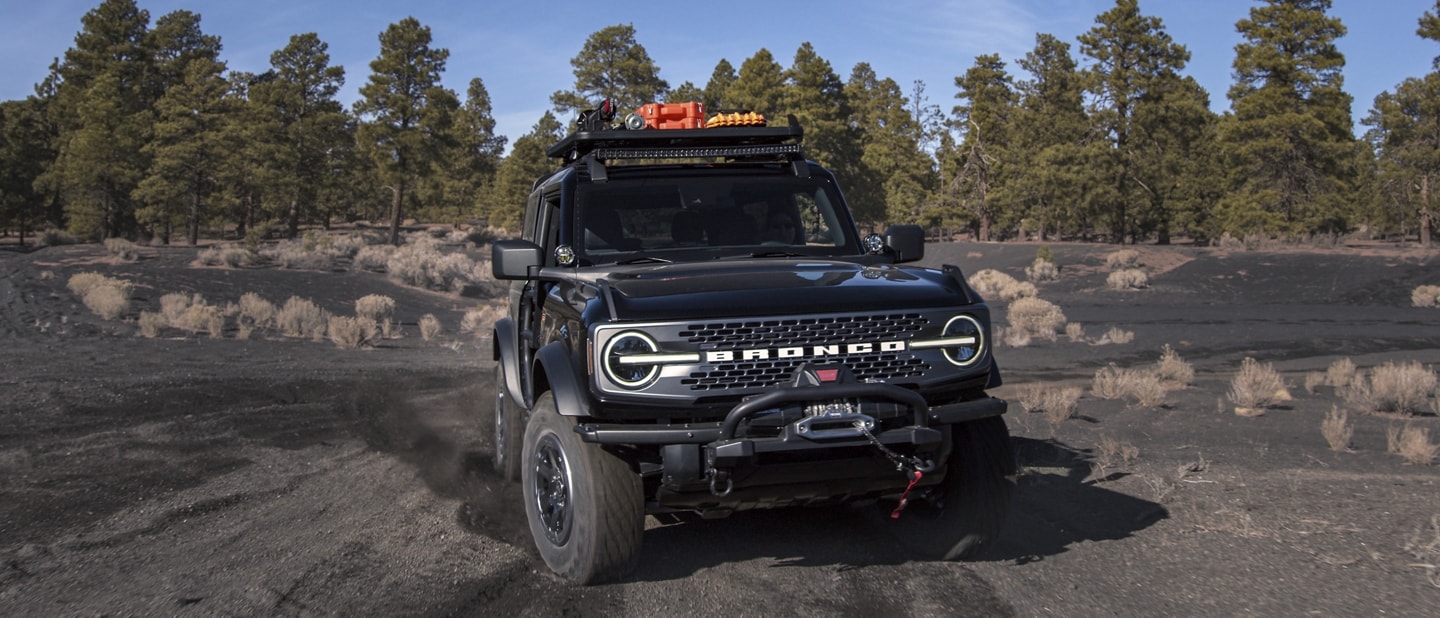 A two-door 2024 Ford Bronco® Badlands® in Shadow Black with available aftermarket accessories