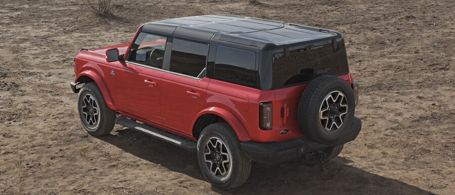Four-door 2024 Ford Bronco® Outer Banks® shown in Race Red with hardtop
