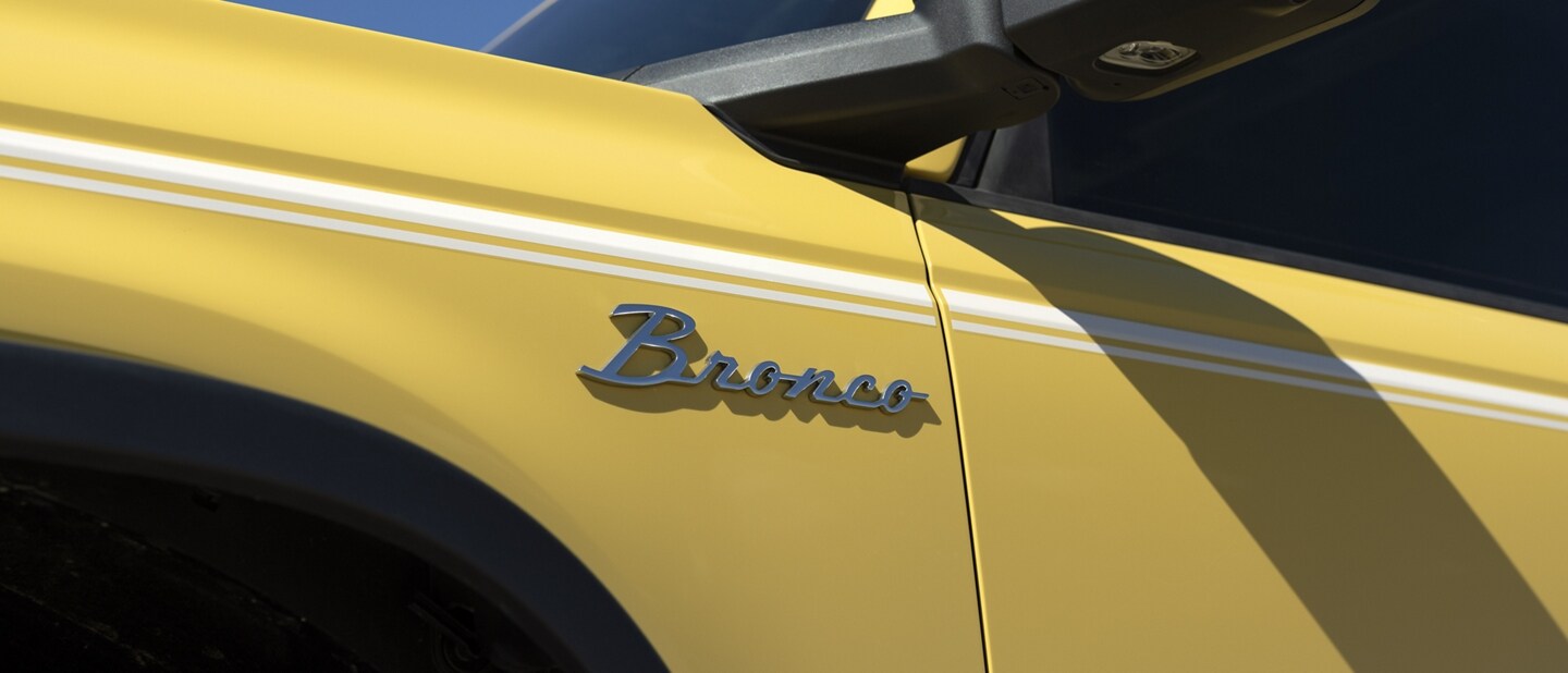 Close-up of metal Bronco® badge on fender of a Bronco® Heritage Limited in Yellowstone