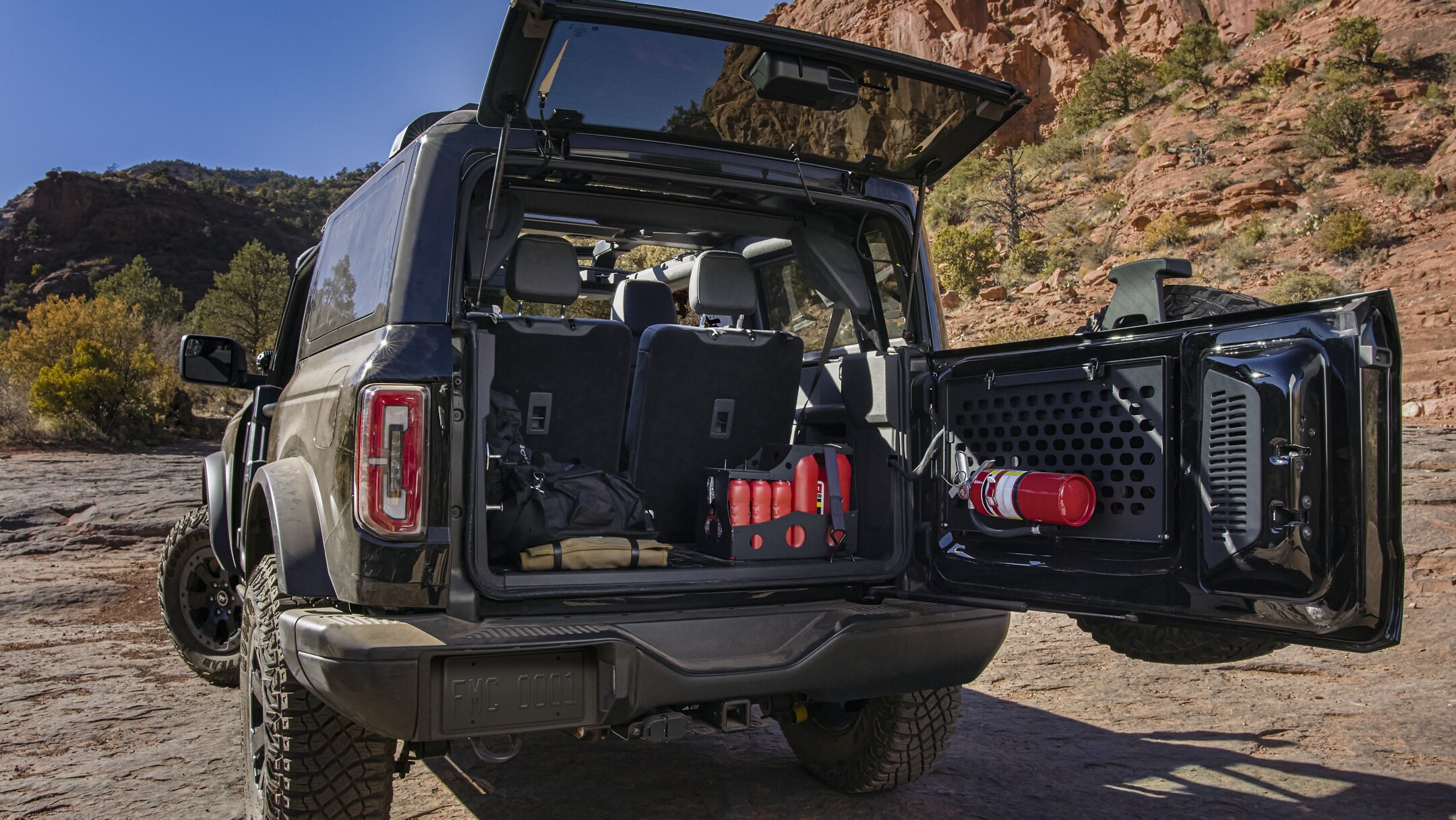 folded down back seats giving 52.3 cubit feet of cargo space to store camping and travel gear in the four door Ford Bronco Black Diamond