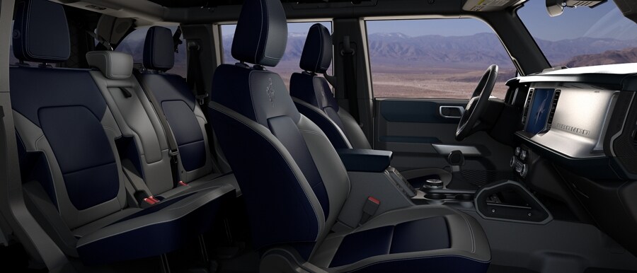 Interior of 2024 Ford Bronco® SUV with available leather-trimmed seats in Dark Space Gray with Navy Pier