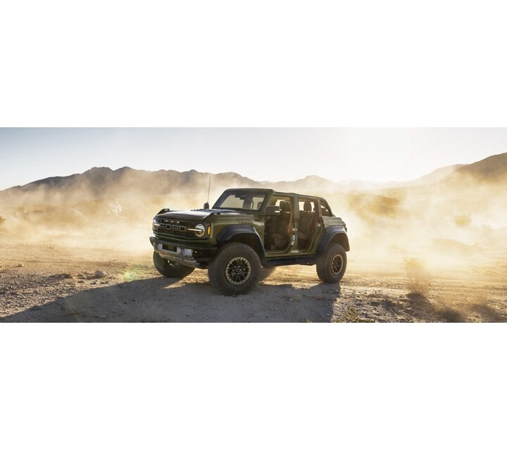 A 2024 Ford Bronco® Raptor® with doors removed and top off in the desert