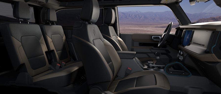 Interior of 2024 Ford Bronco® SUV with available leather-trimmed seats in Medium Sandstone with Black Onyx