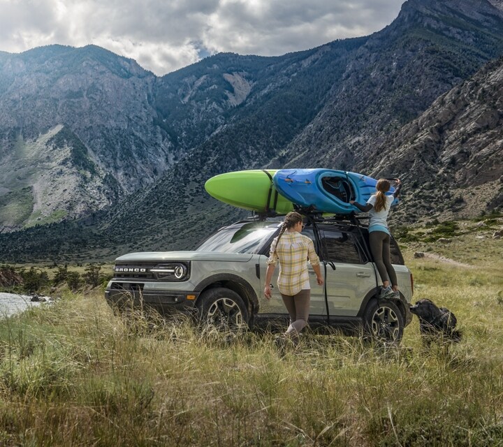 2023 Ford Bronco® Sport SUV parked on the grass next to a river