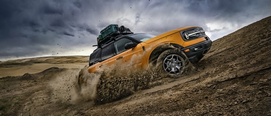 2023 Ford Bronco® Sport SUV parked on the side of a muddy trail covered in mud