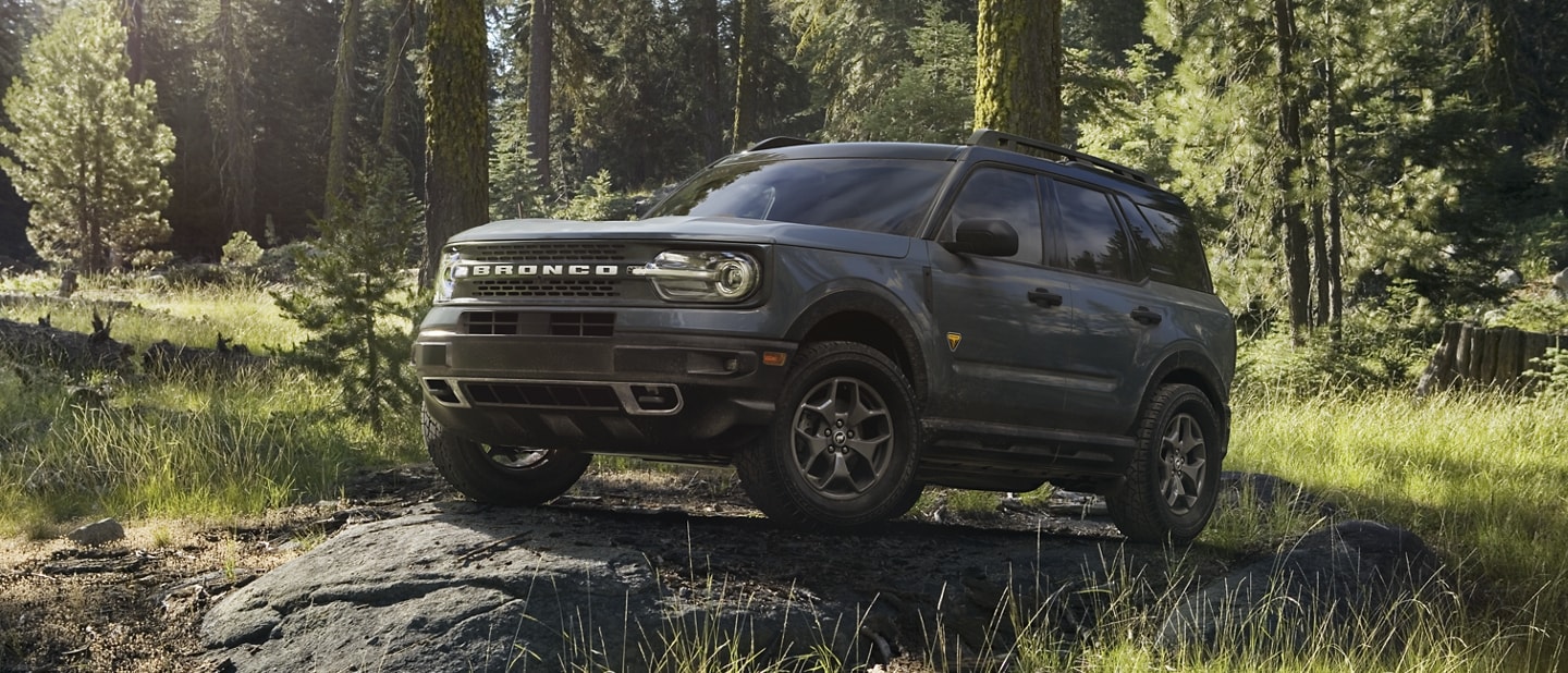 2023 Ford Bronco® Sport SUV parked on a rock slab in a wooded area