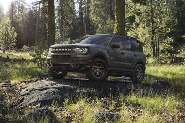 2023 Ford Bronco® Sport SUV parked on a rock slab in a wooded area