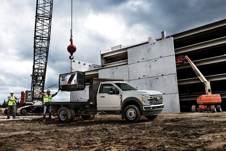2024 Ford Super Duty Chassis Cab under crane.