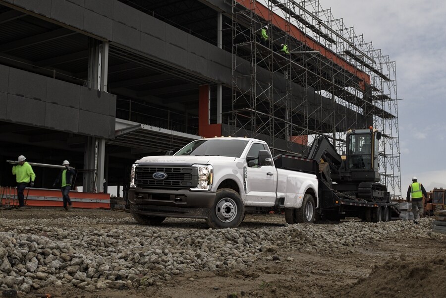 A 2024 Ford Super Duty® Chassis Cab parked at a building construction site