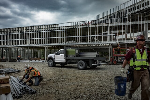2024 Ford Super Duty® Chassis Cab with upfit parked at a job site with workers present