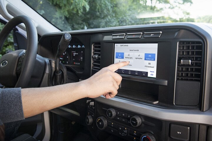 Person using upfit touchscreen in the 2024 Ford Super Duty® Chassis Cab