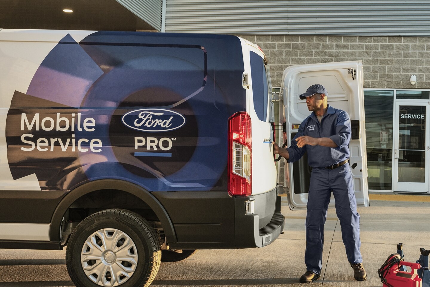 Ford Pro Mobile Service Utility Transit Van being opened by Commercial Ford Pro Mechanic