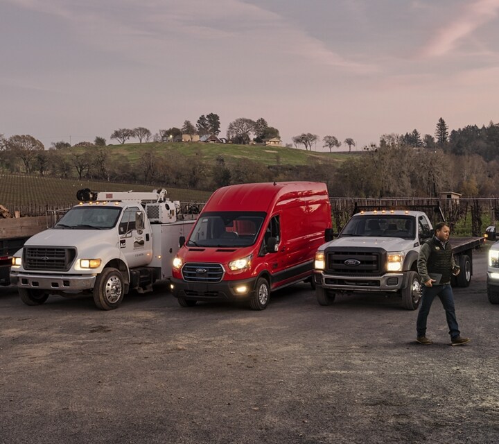 A group of 2023 Ford E-Transit™ vehicles parked
