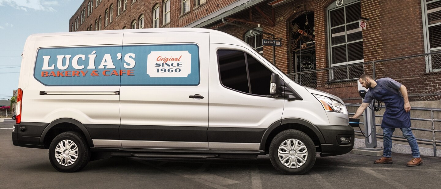 2023 Ford E-Transit™ parked in front of a business