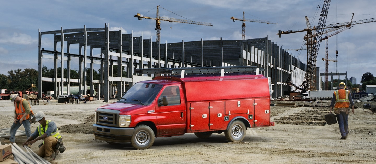 2025 Ford E-Series Cutaway with drive upfit parked at construction site
