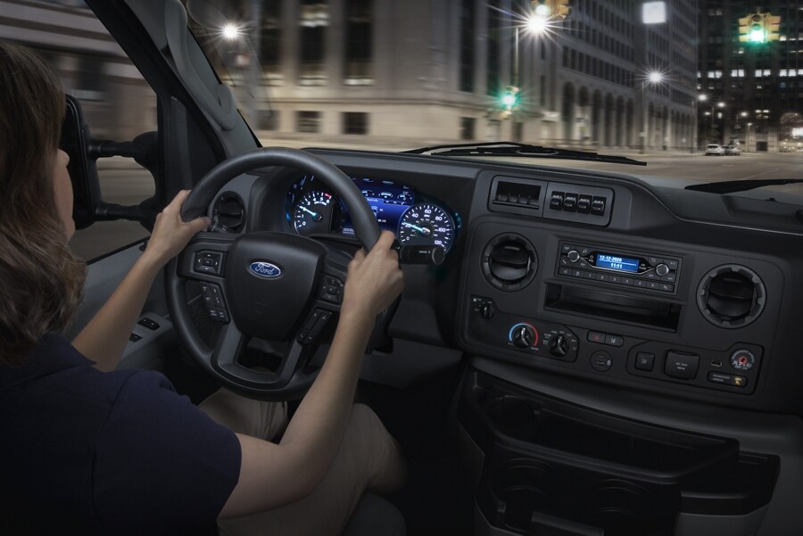 Interior view of the 2026 Ford E-Series Cutaway with a person behind the wheel