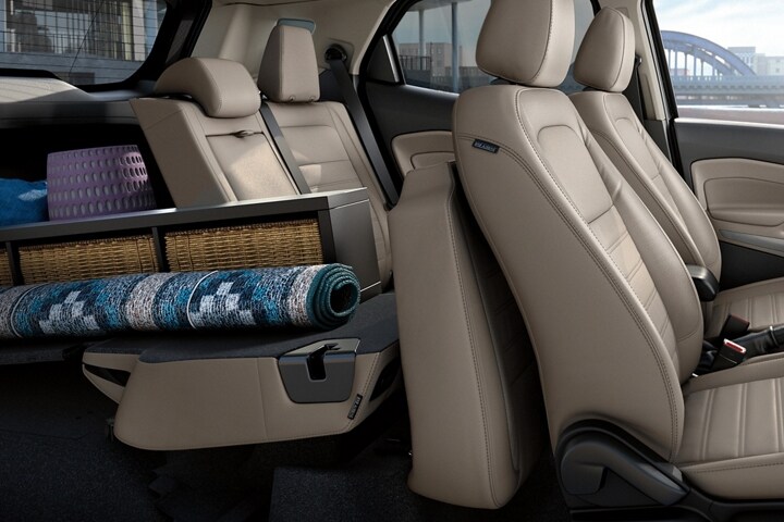Side view of 2021 Ford EcoSport Seating in Light Stone Gray with one second row seat folded down and rear filled with cargo