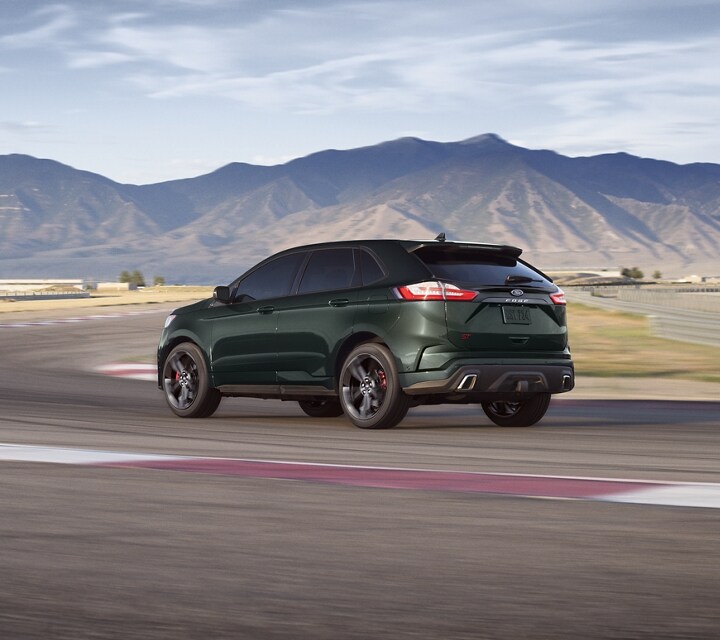 2022 Ford Edge in Forged Green on a curved highway