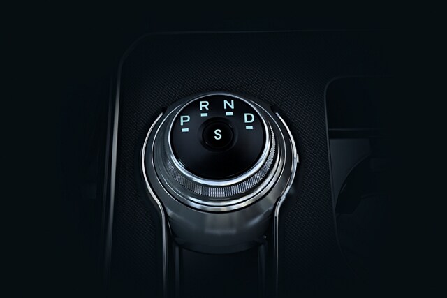 Close-up of the rotary gear shift dial in a 2023 Ford Edge® SUV