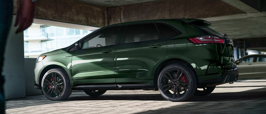 2023 Ford Edge® ST model in Forged Green in a parking structure