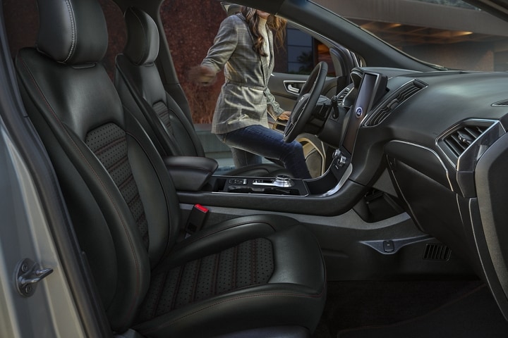 Interior of 2024 Ford Edge® SUV ST-Line with a woman getting into the driver’s seat