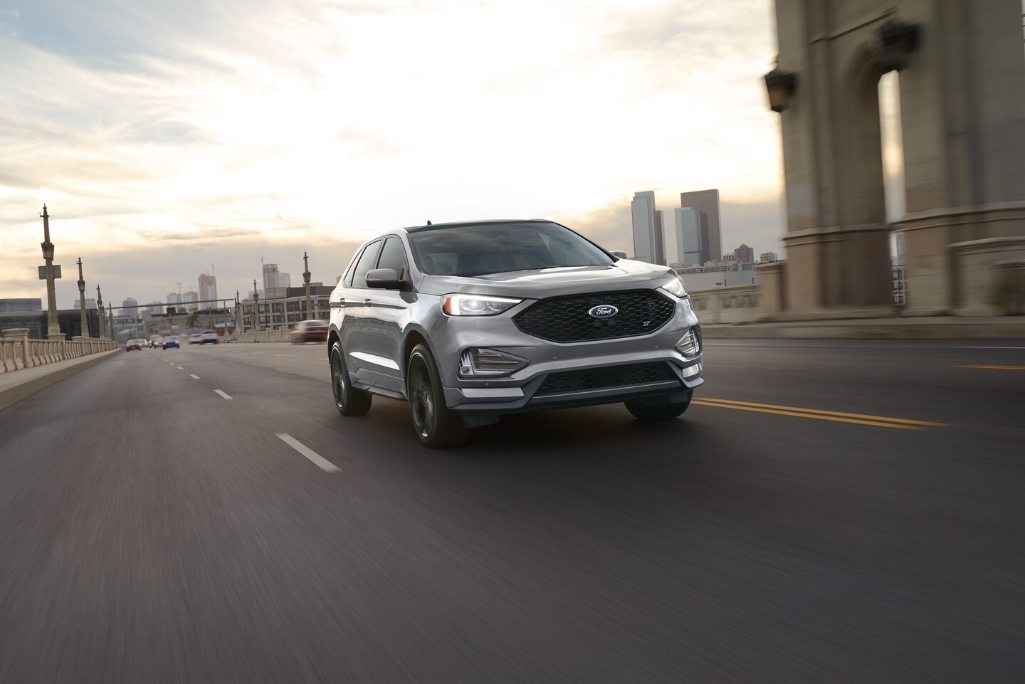 Front view of the 2024 Ford Edge driving down a city street