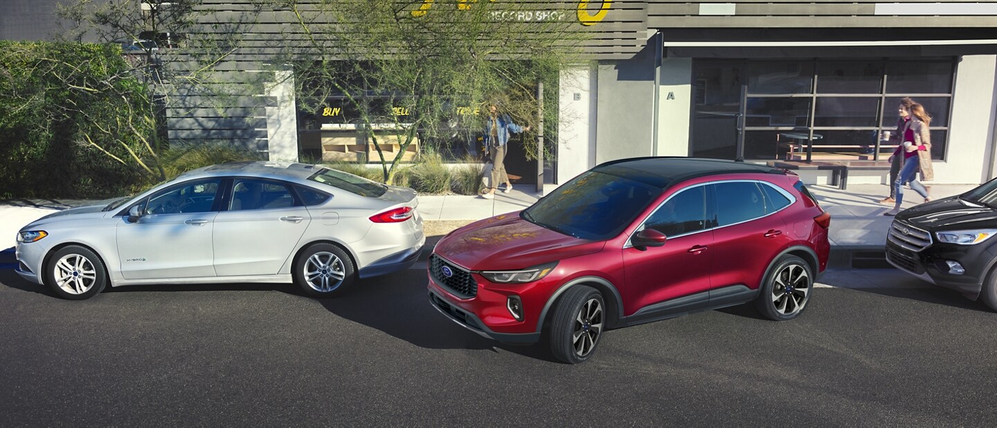 2023 Ford Escape® in Rapid Red Metallic Tinted Clearcoat backing into a parking space