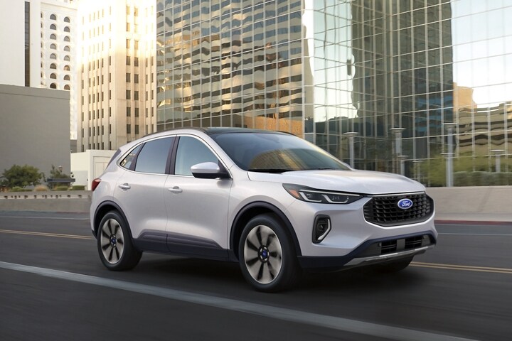 2023 Ford Escape® in Star White being driven down a city road